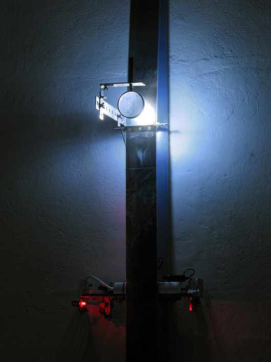 A Single Composite [vert] (2011), acetate film, aluminum, glass, motors, electronic components, LEDs, satellite photographs