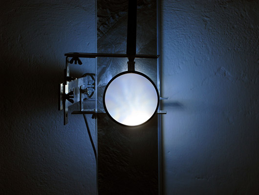 A Single Composite [vert] (2011), acetate film, aluminum, glass, motors, electronic components, LEDs, satellite photographs